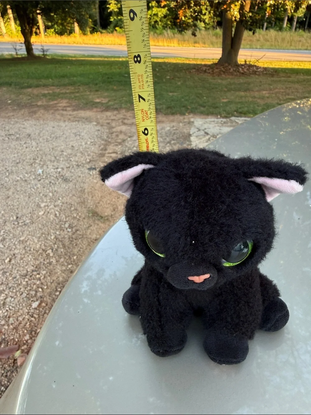 Plush Black Cat Toy with Green Eyes and Pink Accents